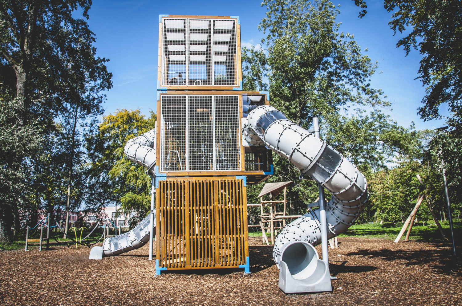 large climbing unit in playground with slides