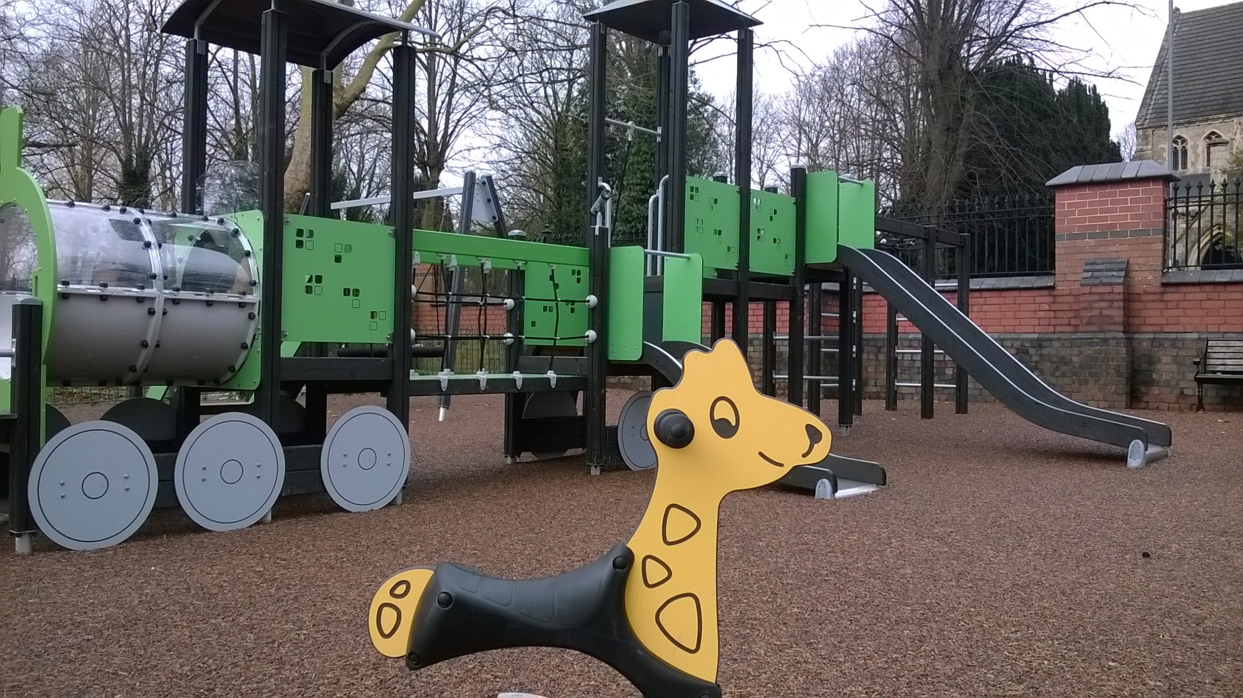 close up of giraffe rocker in a playground