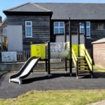 small multiplay tower on grass mat surfacing