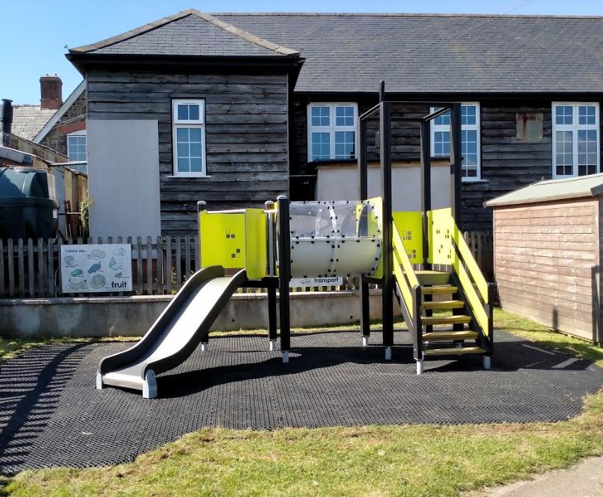 small multiplay tower on grass mat surfacing