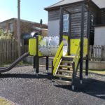 multiplay activity tower on grass mat safety surfacing