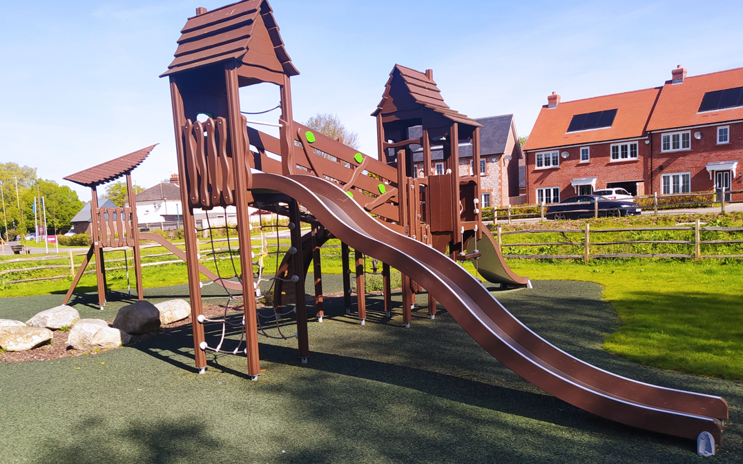 playground installation next to new build houses in Wickham