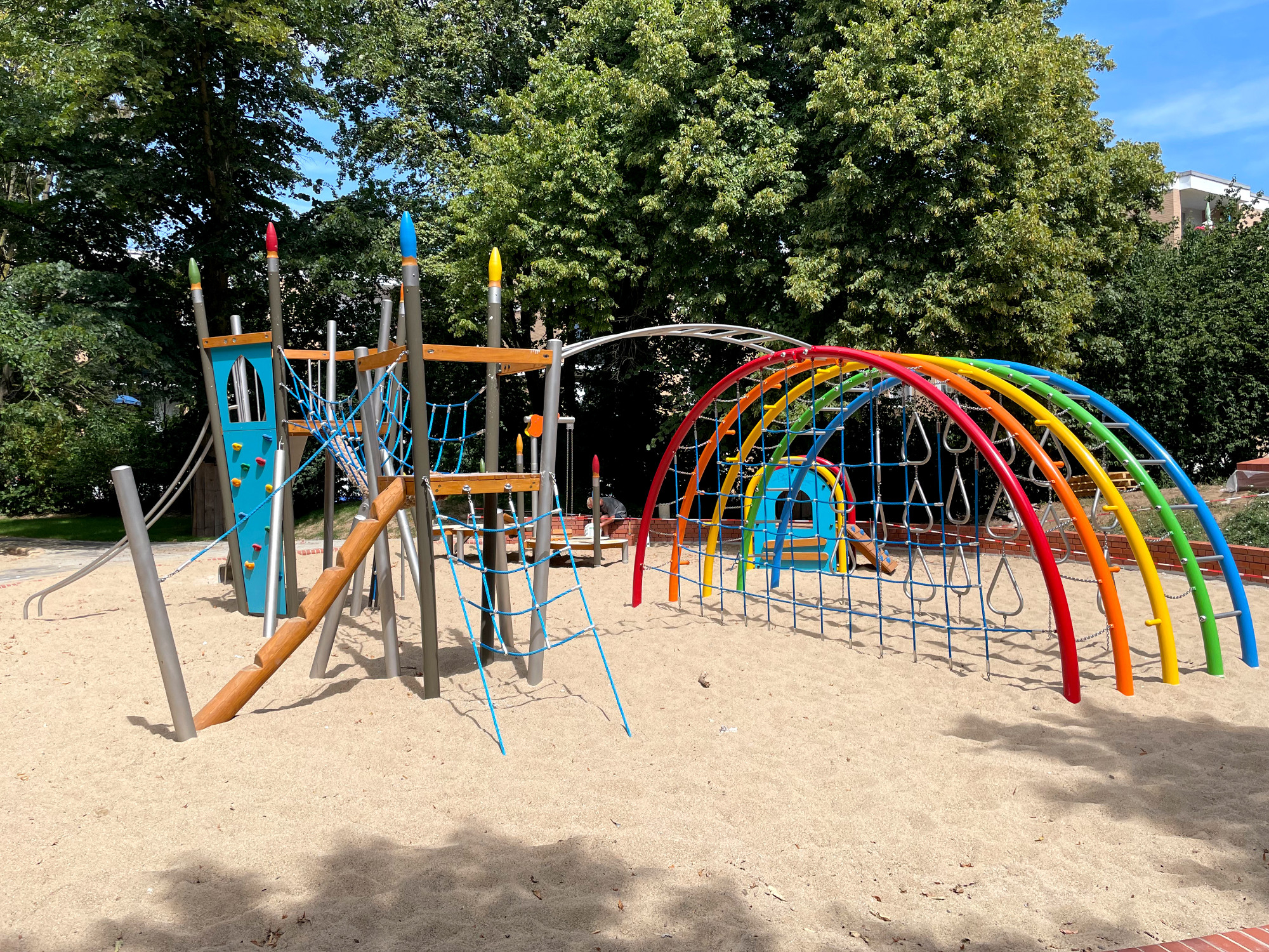 rainbow climbign frame with painting themed equipment