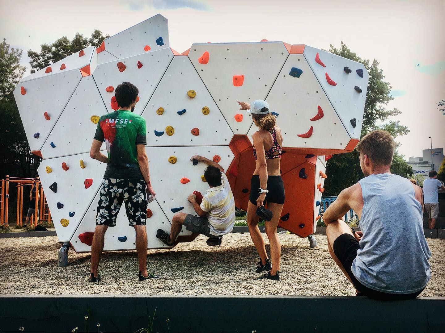 adults on bouldering wall