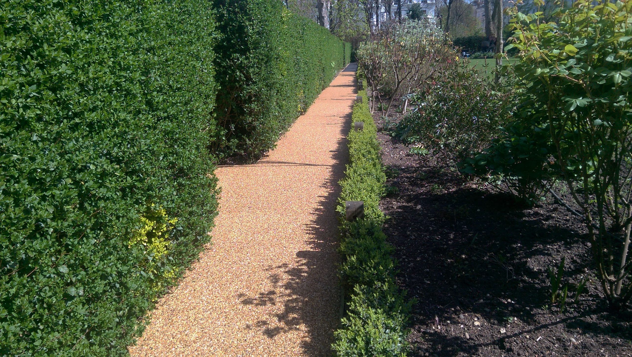 Eco-friendly and permeable resin bound gravel surfacing supporting SUDS