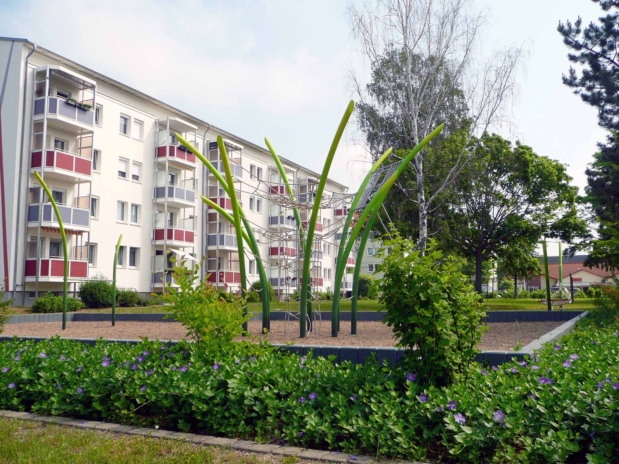 Lifelike grass texture on GrasArt playground equipment made from stainless steel.
