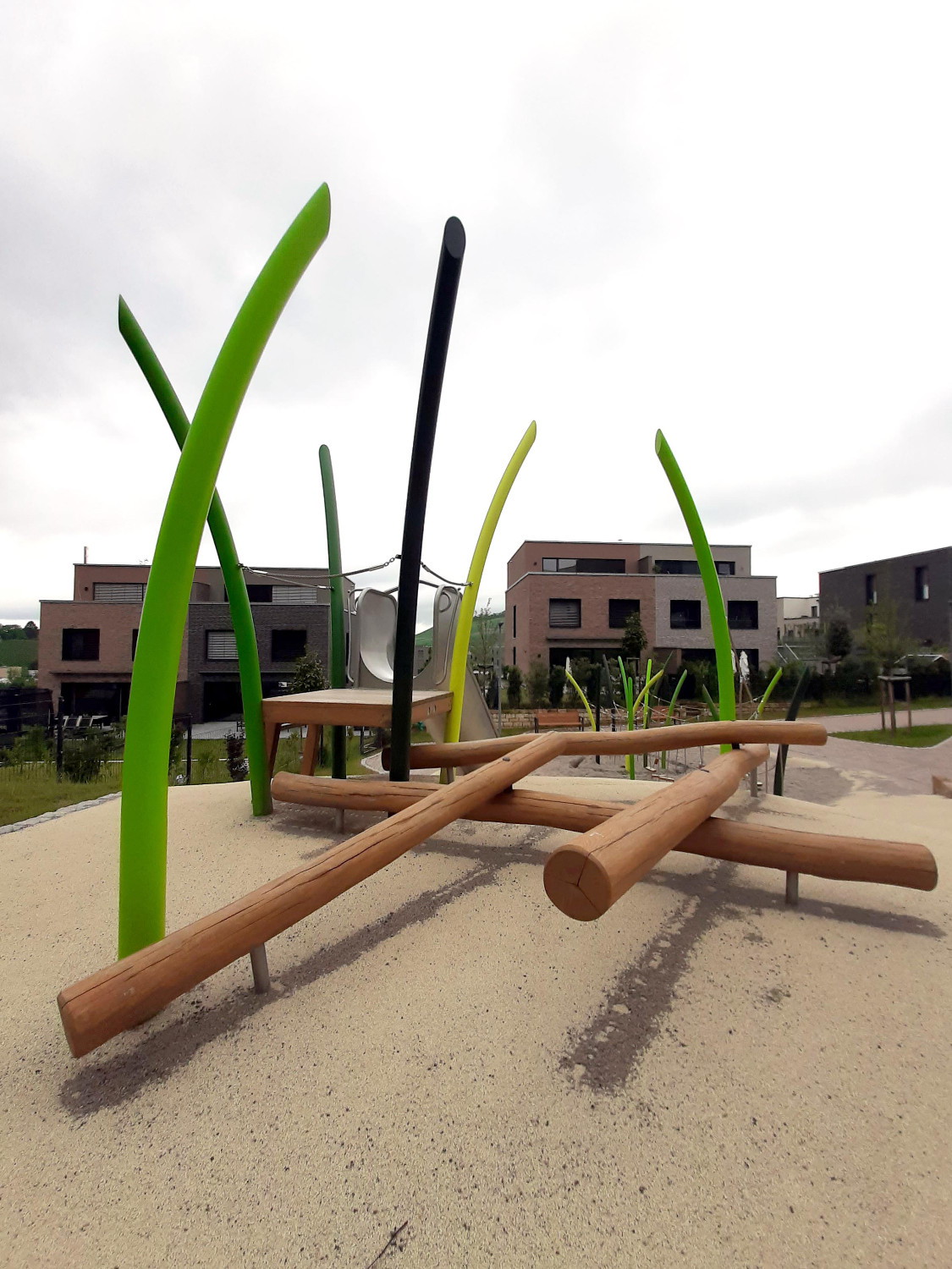 Close-up of stainless steel playground equipment designed to mimic grass, by GrasArt.