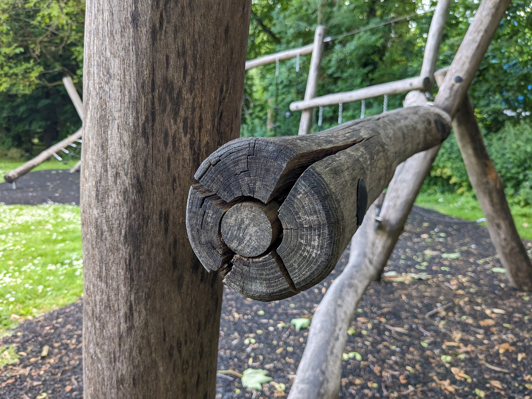 Cracked robinia wood on playground equipment