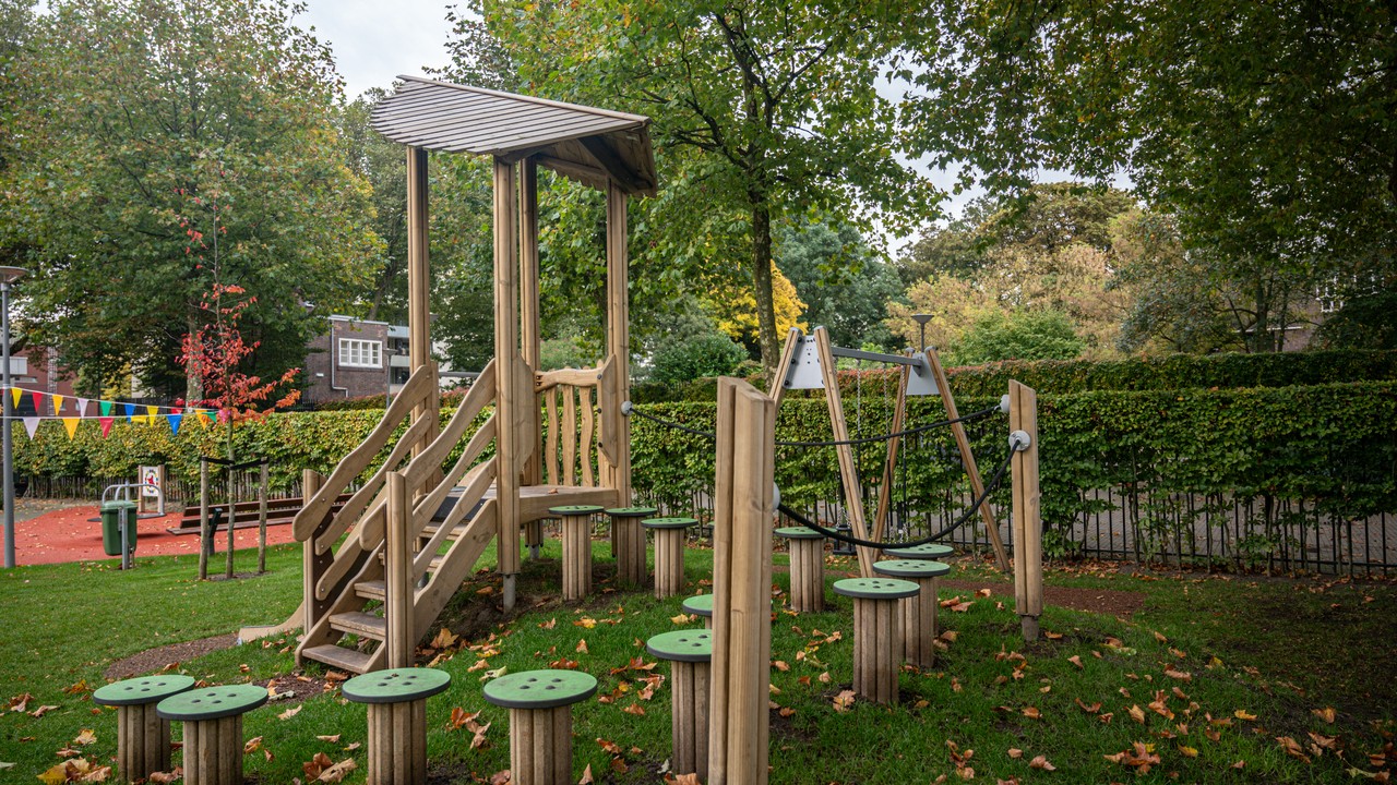 wooden trim trail and playground equipment