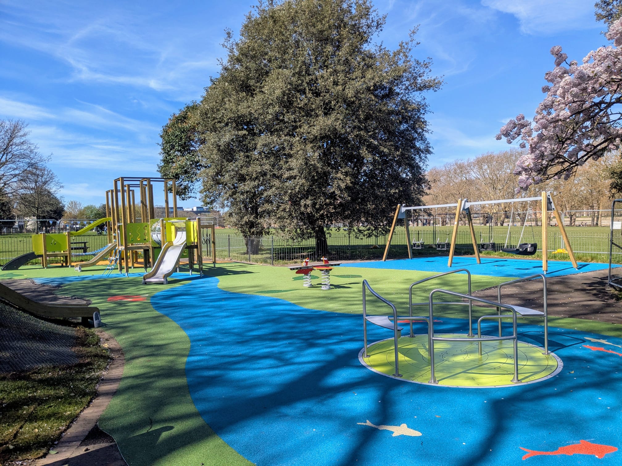 Inclusive playground with wheelchair roundabout and sensory panels