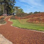 Newly installed TigerTrak path with surrounding heather and orange safety fencing